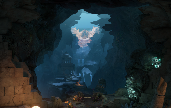 Cave with ancient ruins and a large statue