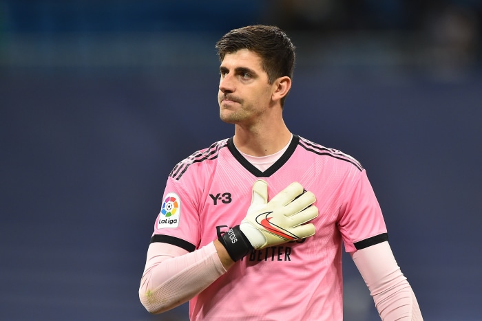 Thibaut Courtois wearing pink Y-3 Real Madrid jersey