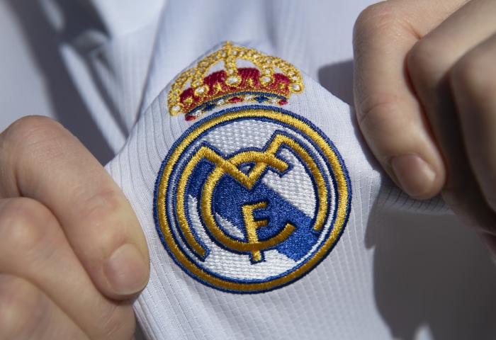 Real Madrid C.F. logo on a white shirt