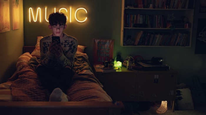 Nick Nelson from Heartstopper in his bedroom