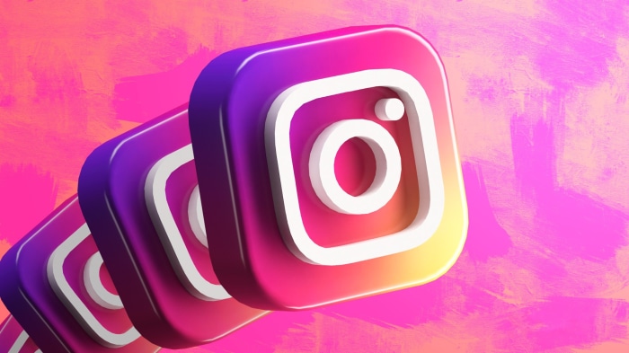 Instagram logo icons on a pink and orange background