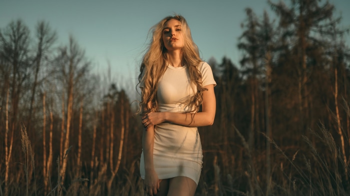Model in white dress in forest