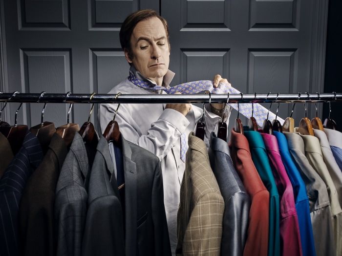 Saul Goodman from Better Call Saul tying his tie