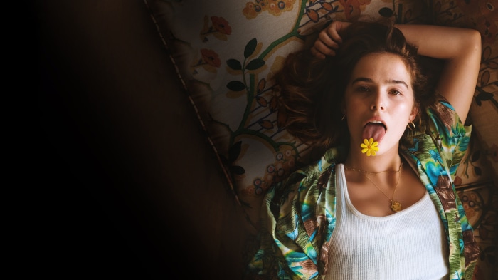 Woman with flower on tongue