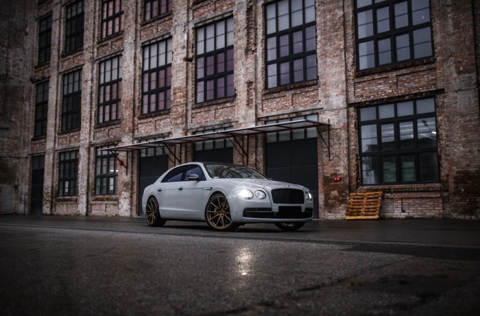 Bentley Flying Spur in front of brick building