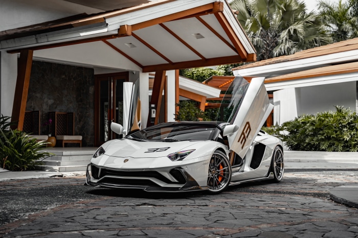 White Lamborghini Aventador with butterfly doors