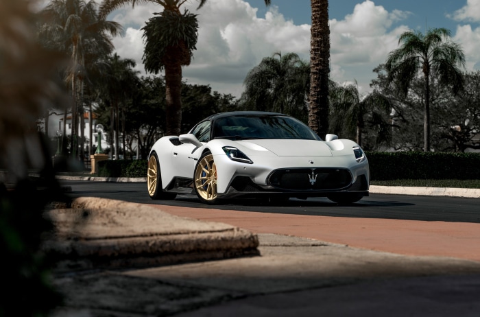 White Maserati MC20 with gold wheels