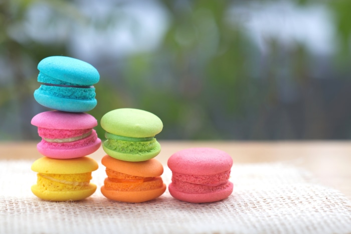 Colorful Macarons Stacked on Burlap