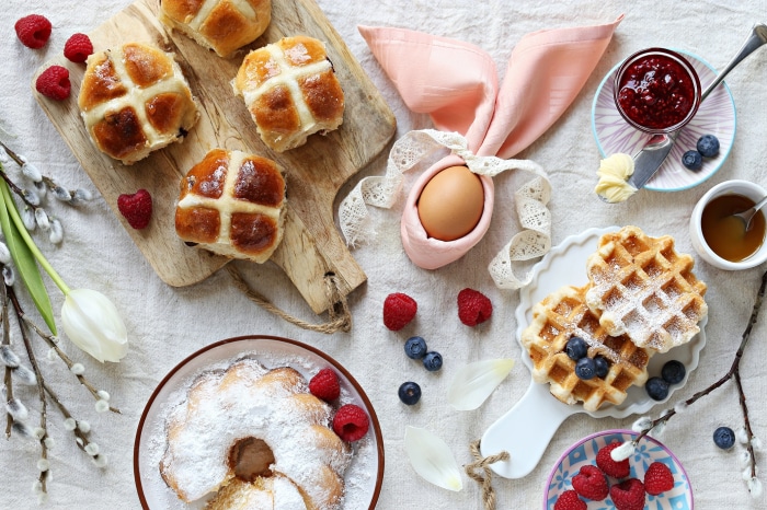 Easter breakfast with hot cross buns and waffles