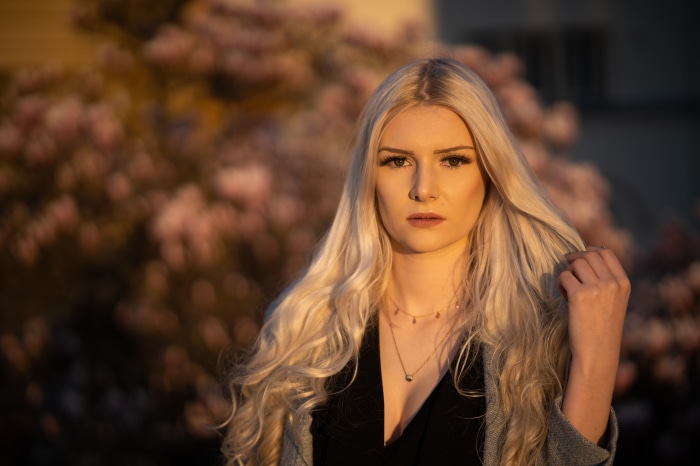 Model with blonde hair and flowers