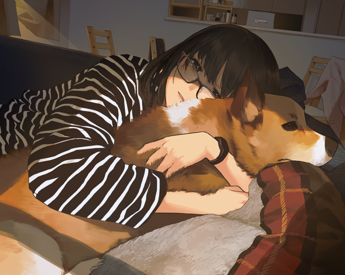 Girl hugging a corgi dog