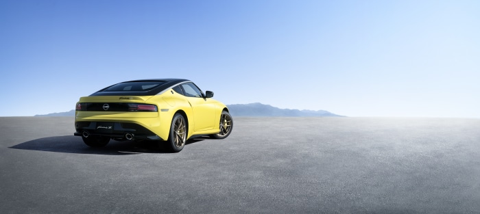 Yellow Nissan Fairlady Z car on asphalt