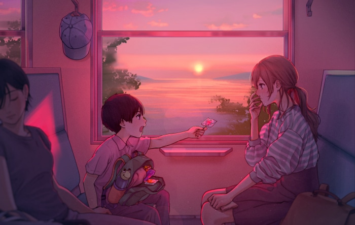 Children on a train at sunset