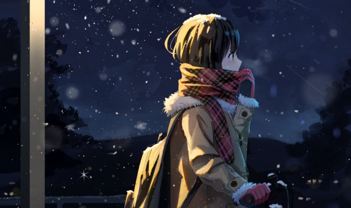 Girl in winter coat and scarf in snow