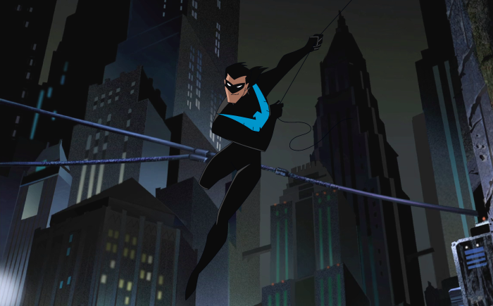 Nightwing swinging through a dark city at night