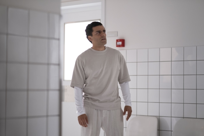 Marc Spector from Moon Knight in a white room