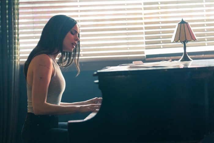 Sofia Carson playing piano in Purple Hearts