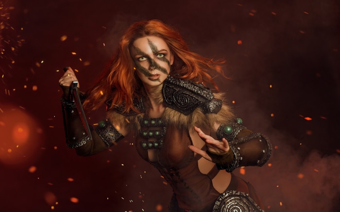Redhead warrior with face paint and sword
