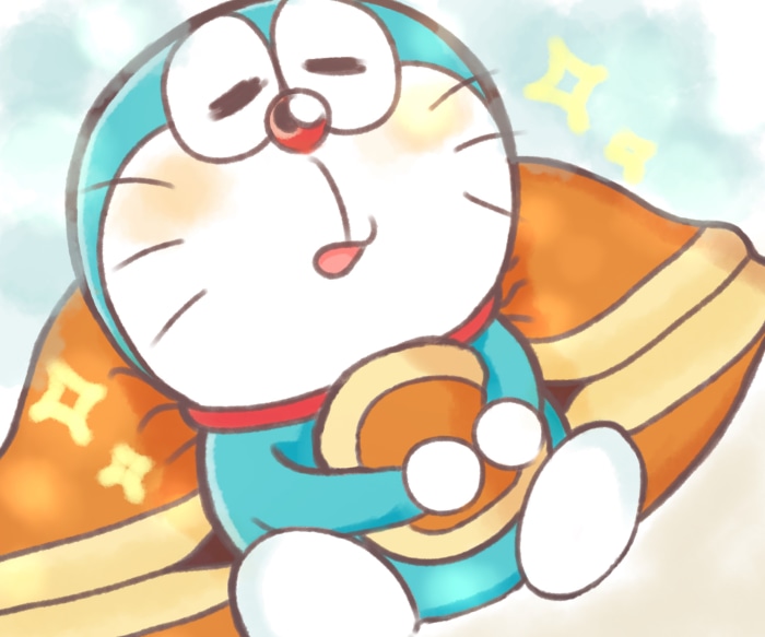 Doraemon holding a round object