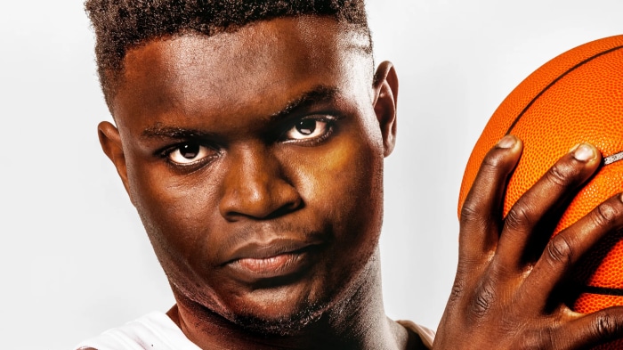 Zion Williamson with a basketball