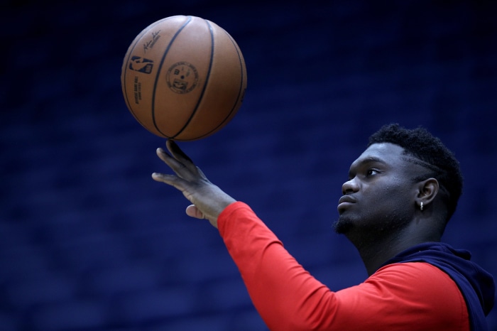 Zion Williamson spinning a basketball