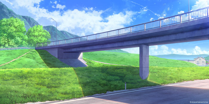 Bridge over a grassy hill under a blue sky