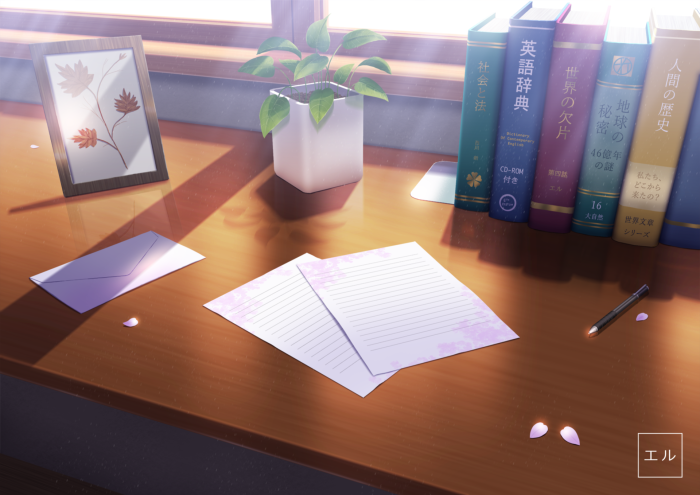 Desk with books, papers, and a framed picture
