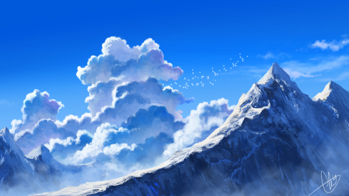 Snow-capped mountains under a blue sky with clouds