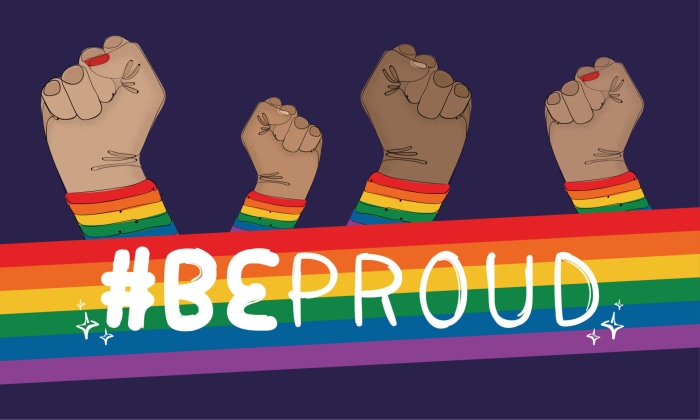 Fists raised with rainbow armbands and #BEPROUD text
