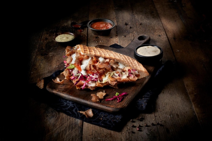 Doner Kebab with Sauces on Wooden Board
