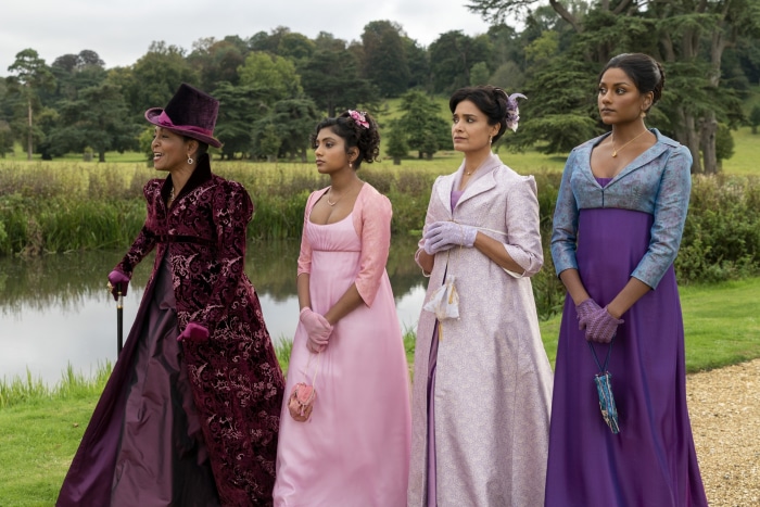 Four women in Regency-era dresses in Bridgerton