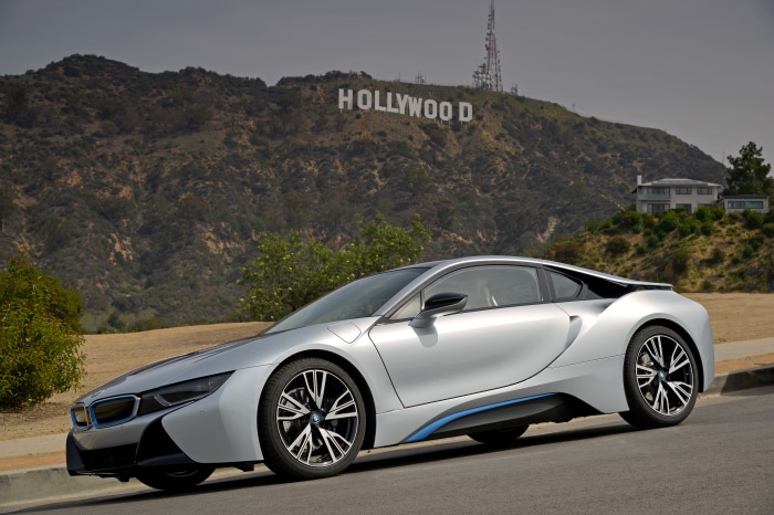 Silver BMW i8 in front of Hollywood Sign