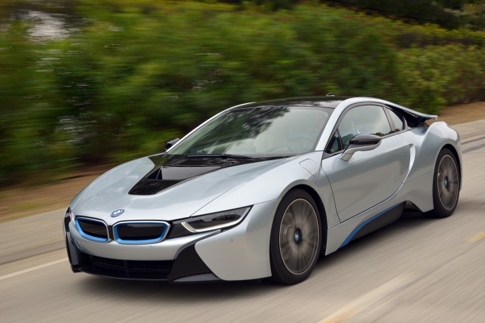 Silver BMW i8 driving on a road