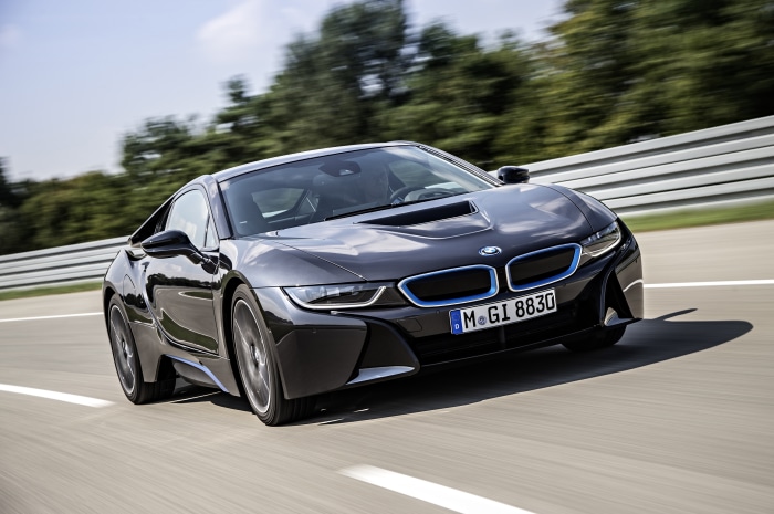 Black BMW i8 driving on a race track