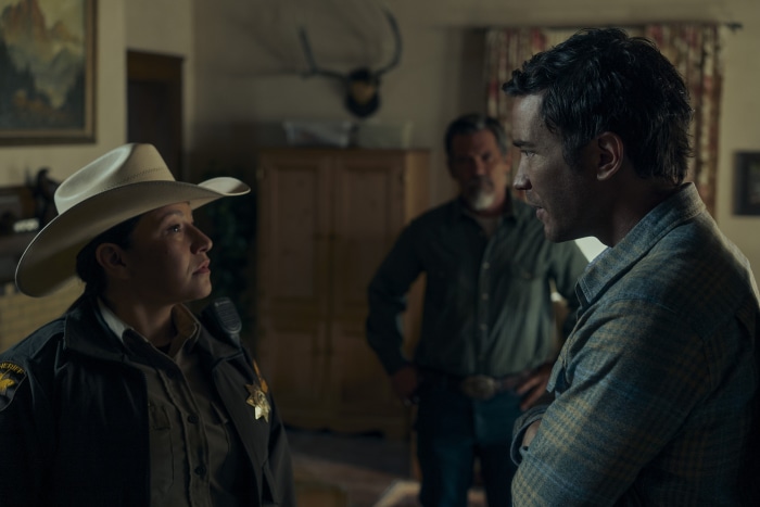 Sheriff and two men in a room