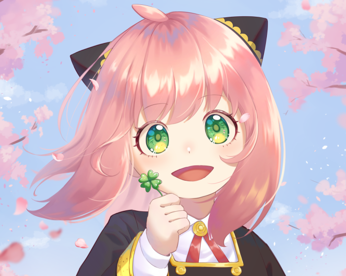 Anya Forger from Spy X Family holding a four-leaf clover