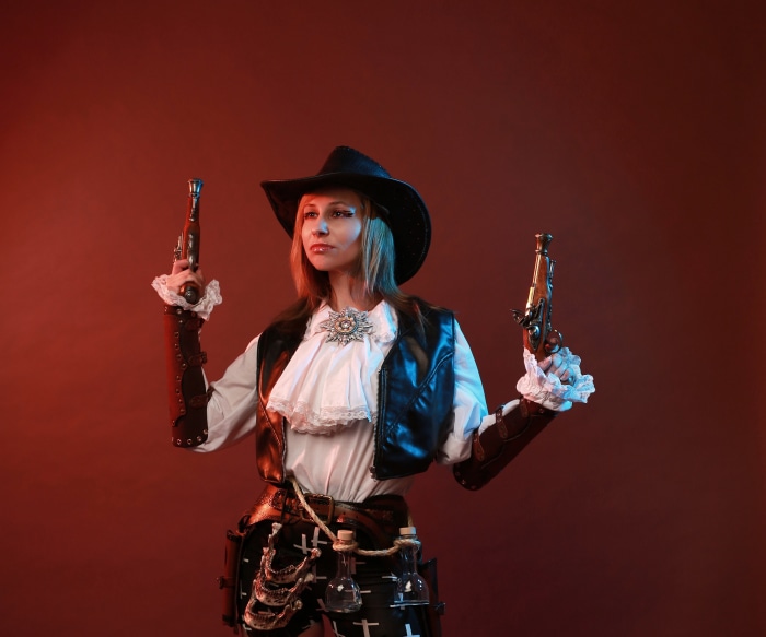 Woman in Steampunk Cowboy Outfit with Guns