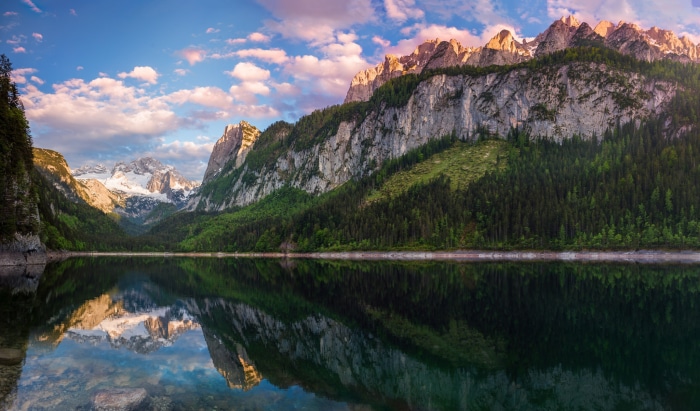 Mountain lake reflection at sunrise