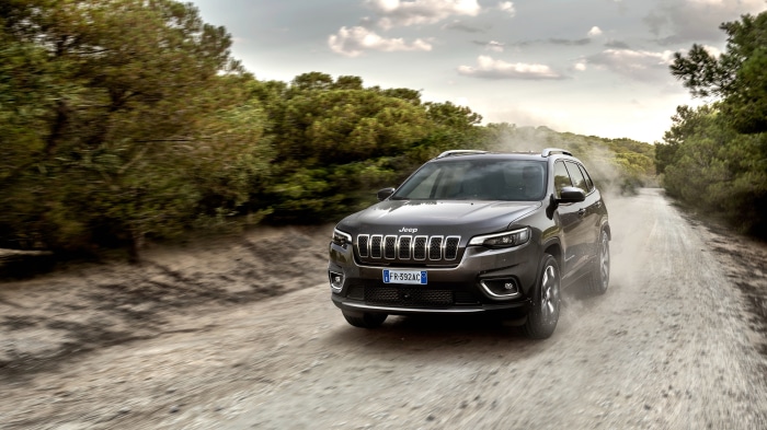 Jeep Cherokee driving on a dirt road