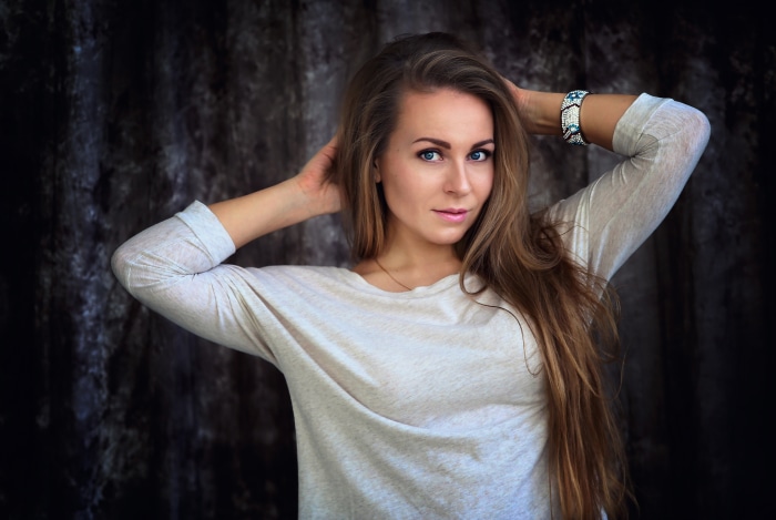 Woman with long brown hair and blue eyes