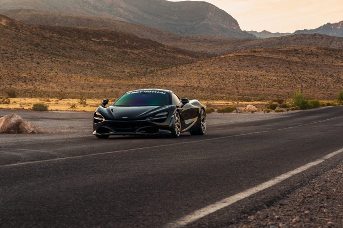 Black McLaren 720S on a desert road