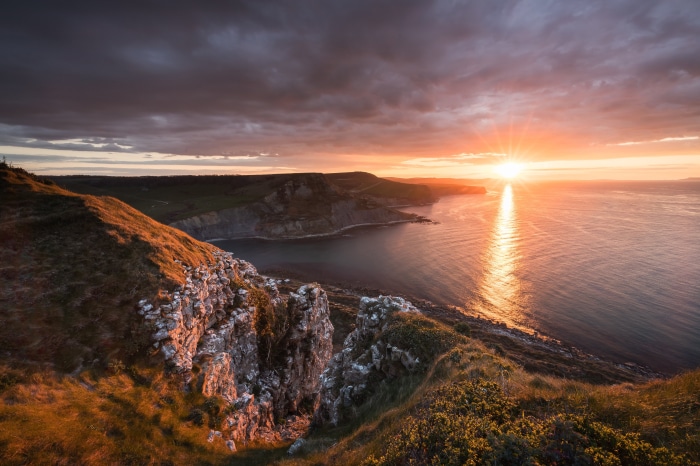 Sunset over a rocky coastline