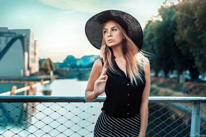 Woman in a black hat and dress