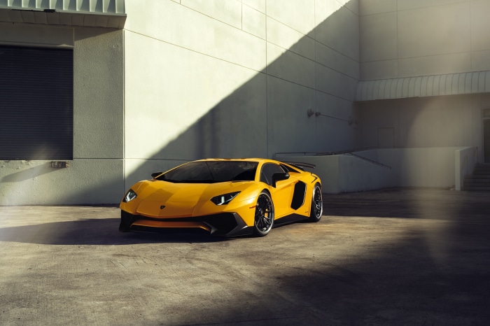 Yellow Lamborghini Aventador parked outdoors