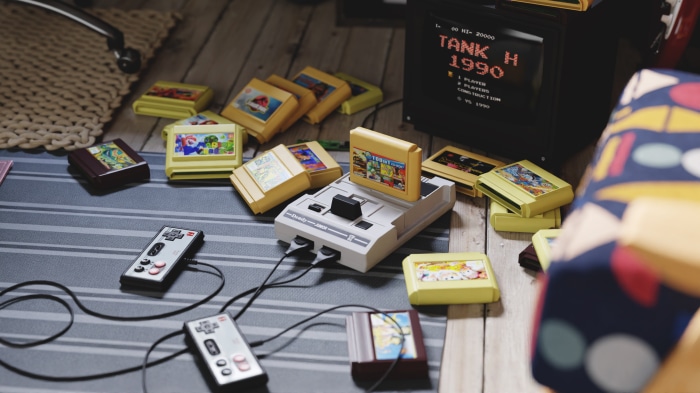 Retro video game console with cartridges and controllers