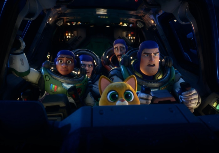 Buzz Lightyear and crew in a spaceship cockpit