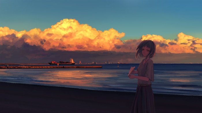 Girl on beach with cargo ship at sunset
