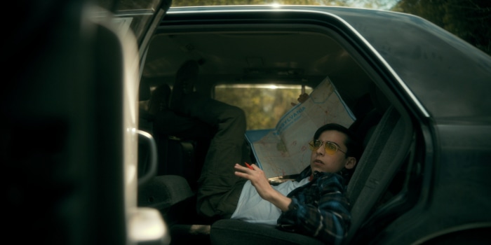 Number Five from The Umbrella Academy in a car