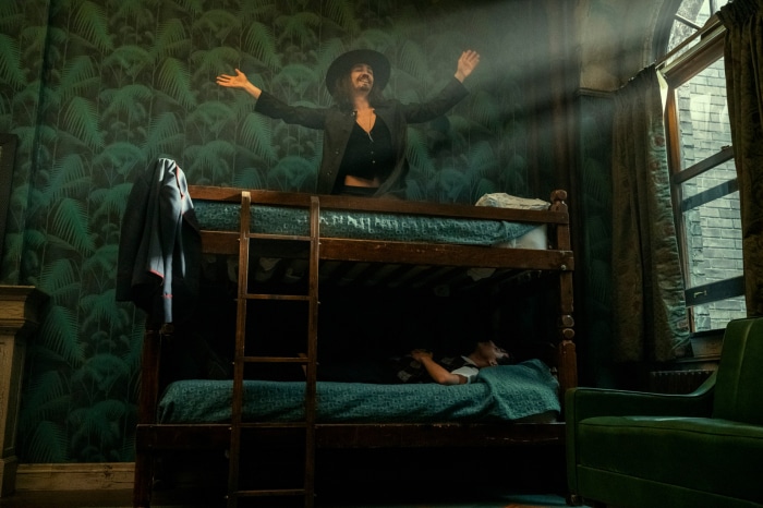 Klaus Hargreeves from The Umbrella Academy on a bunk bed