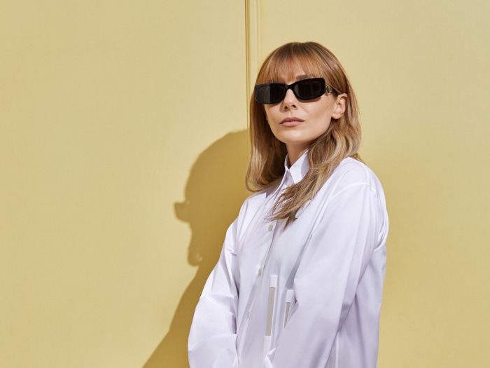 Elizabeth Olsen wearing sunglasses and white shirt